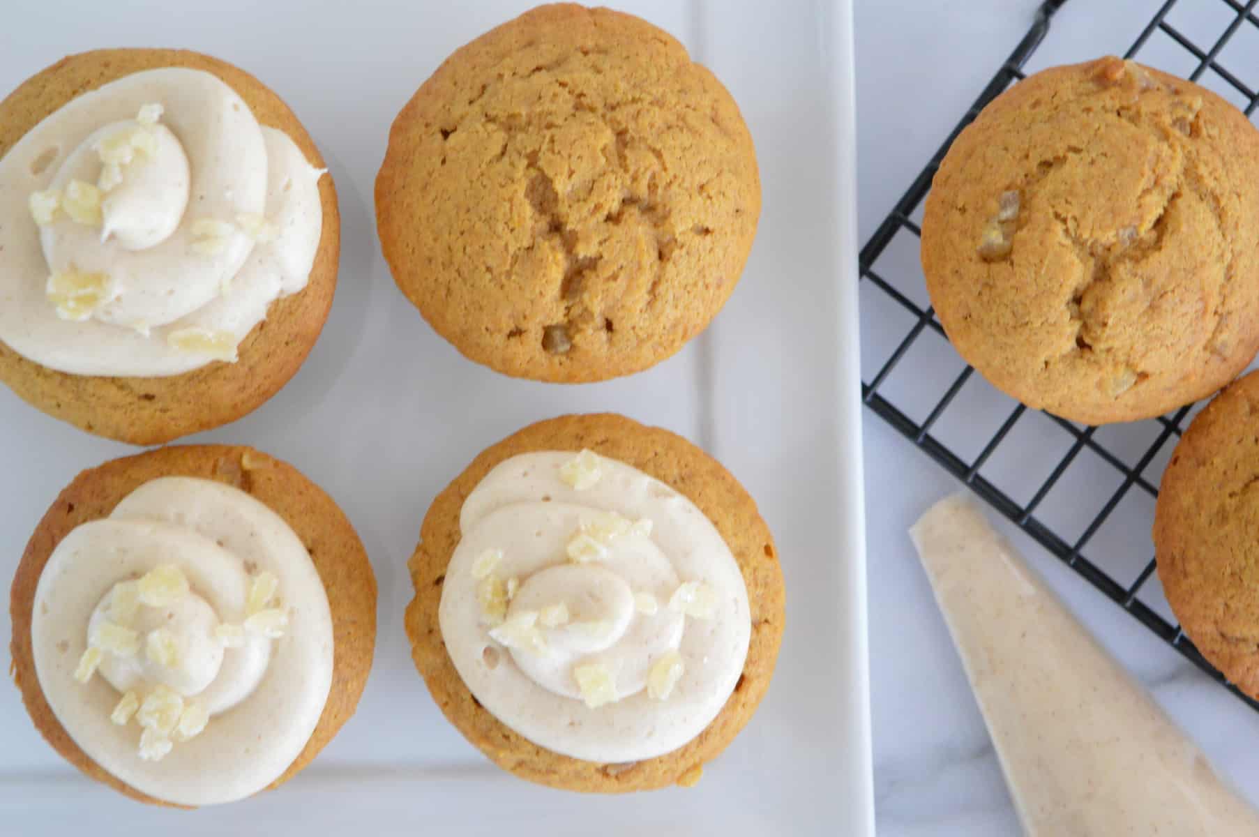 frosted cupcakes on a plate.