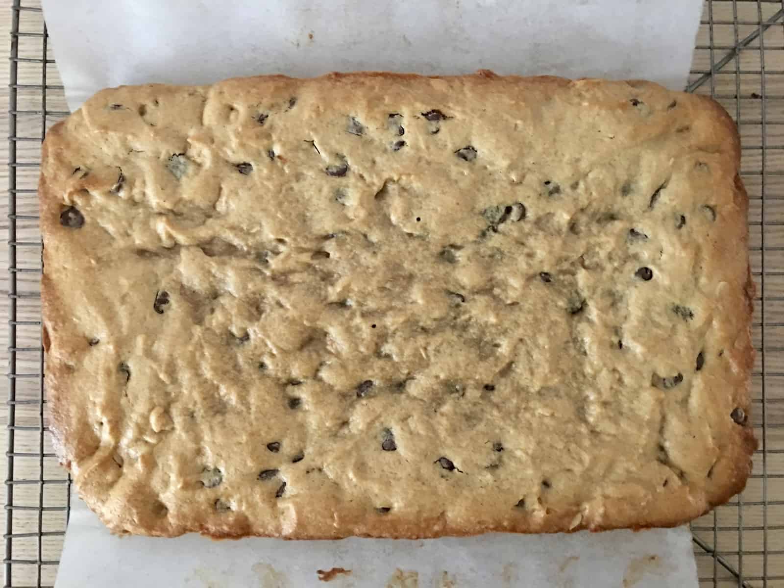 peanut butter banana blondies in a glass baking pan lined with parchment. 