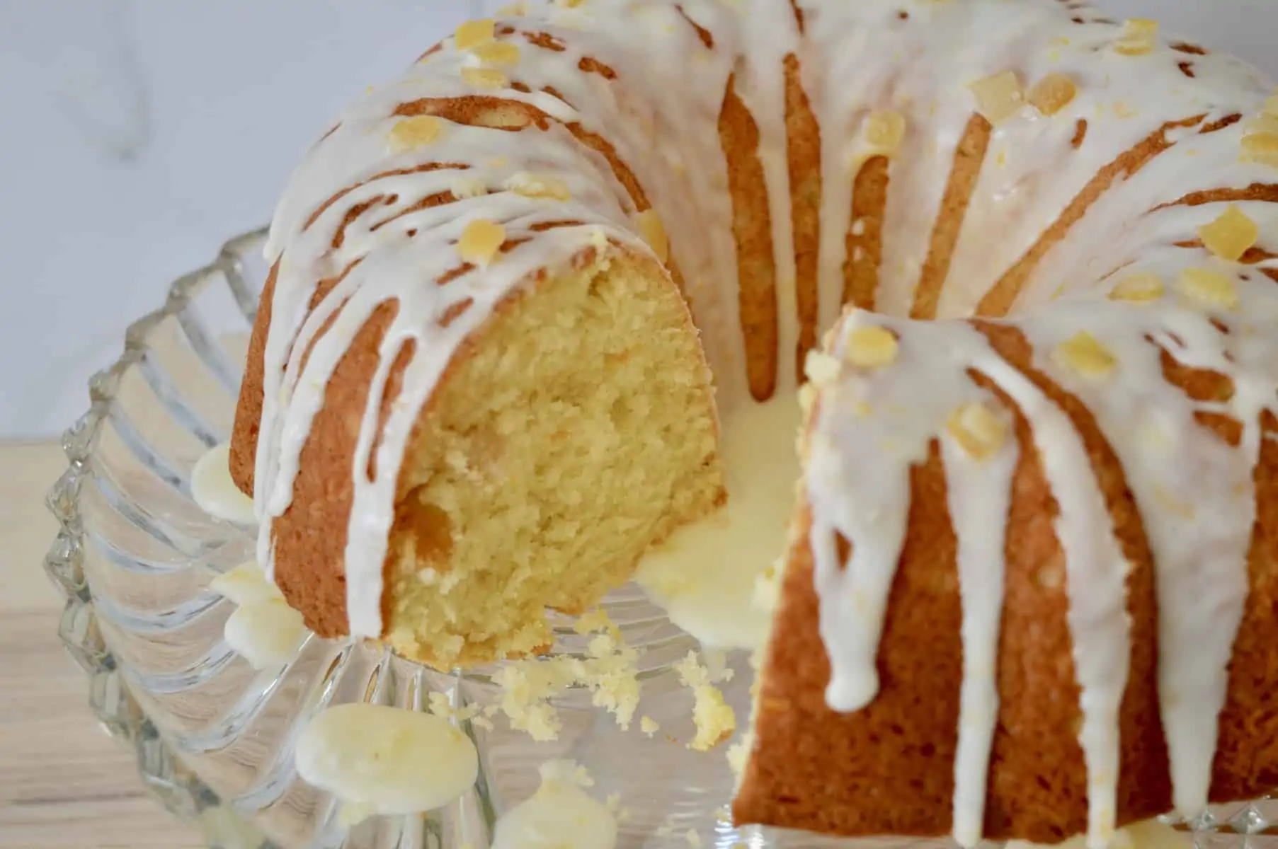 Orange Mascarpone Ciambellla on a glass cake pedestal.