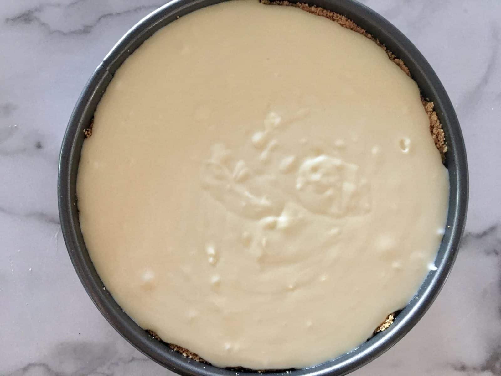 cream cheese mixture poured on top of the amaretti cookie crust. 