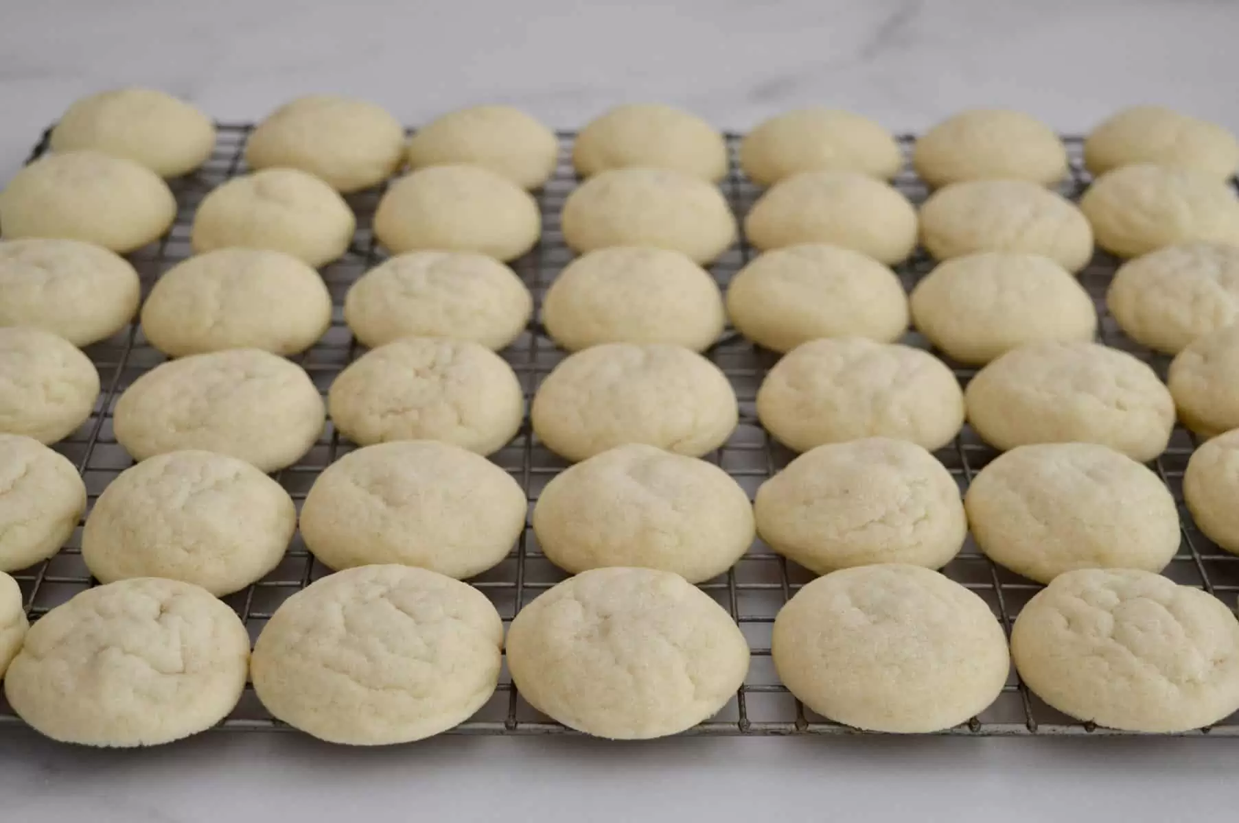 Greek Butter cookies cooling on a wire cooling rack.