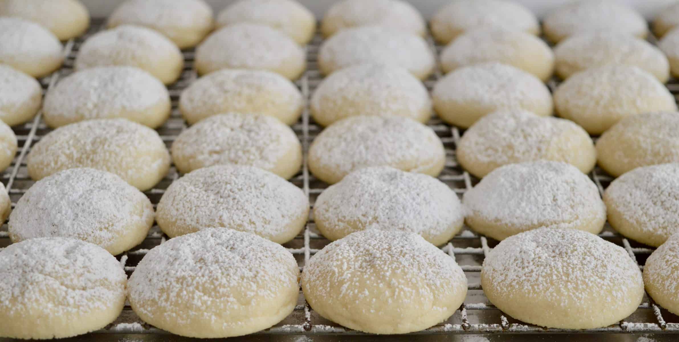 Greek Butter Cookies on a cooling rack. 