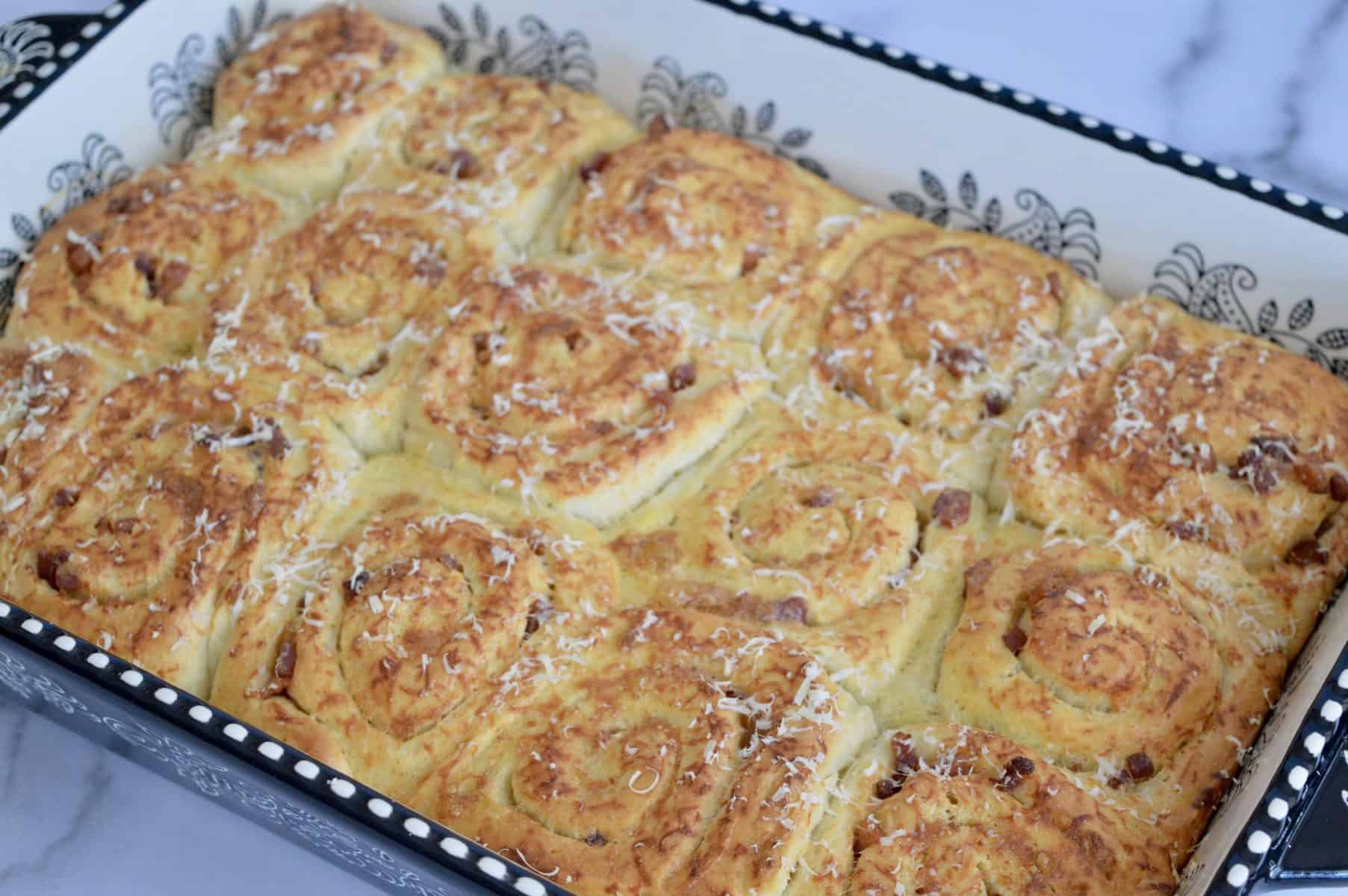 pinwheel bread rolls in a baking dish. 