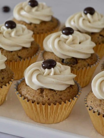 Espresso Cupcakes with chocolate covered espresso beans on top.