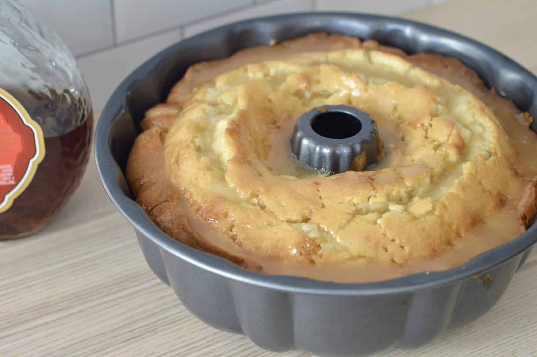 Amaretto Pound Cake in a pan with Amaretto butter glazed poured over it. 