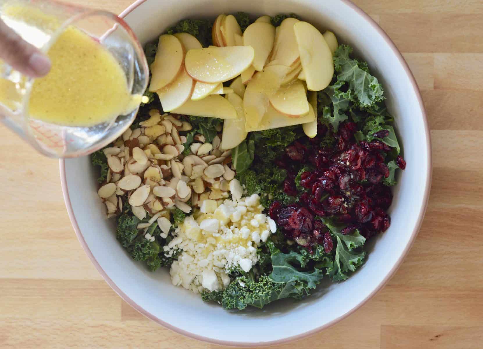 lemon vinaigrette poured over ingredients in large bowl. 