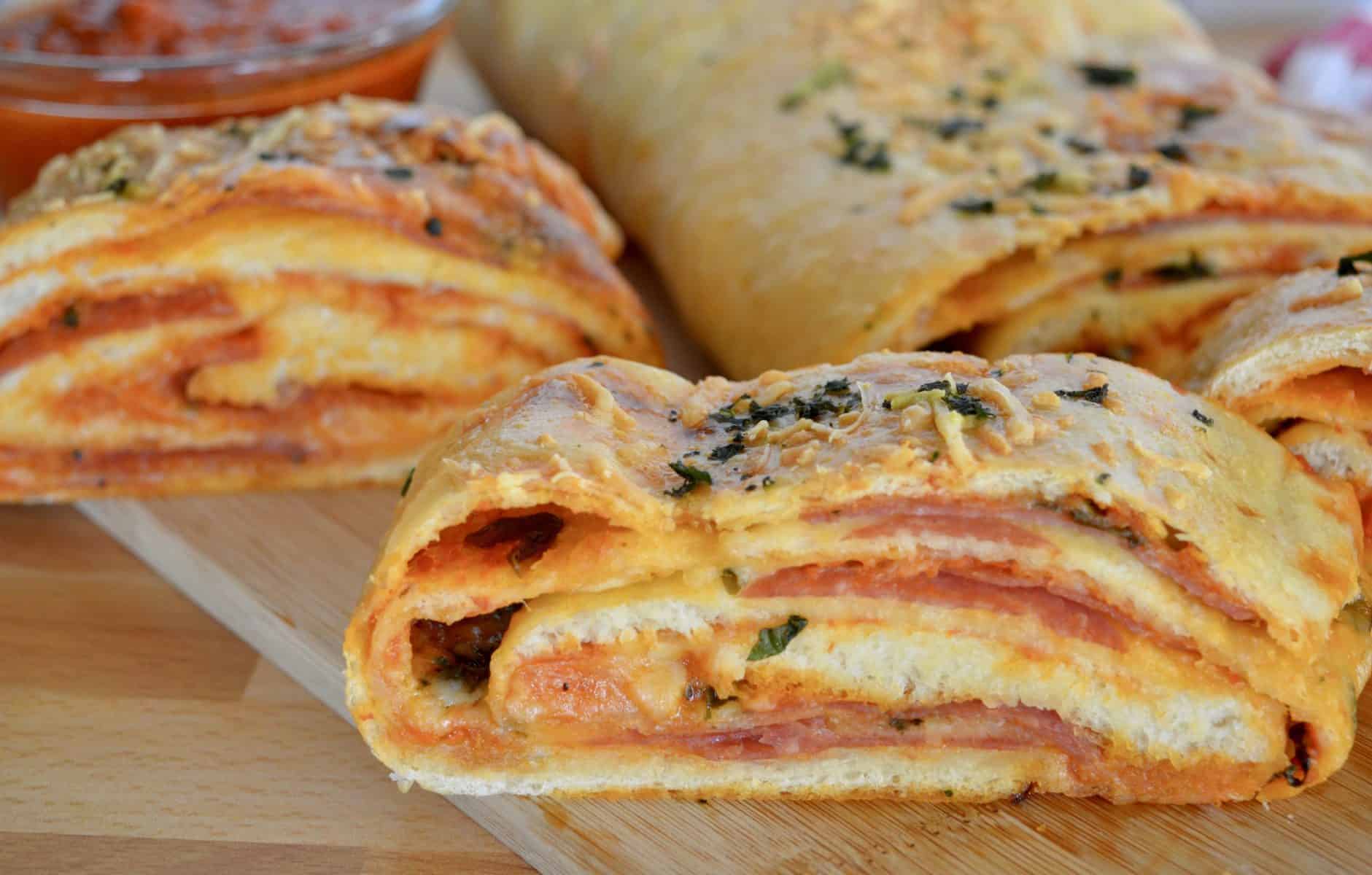 Italian Stromboli on a wood cutting board. 