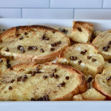 cannoli baked French toast in a white casserole dish.