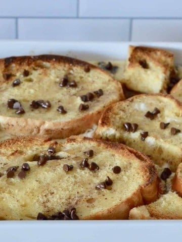 cannoli baked French toast in a white casserole dish.