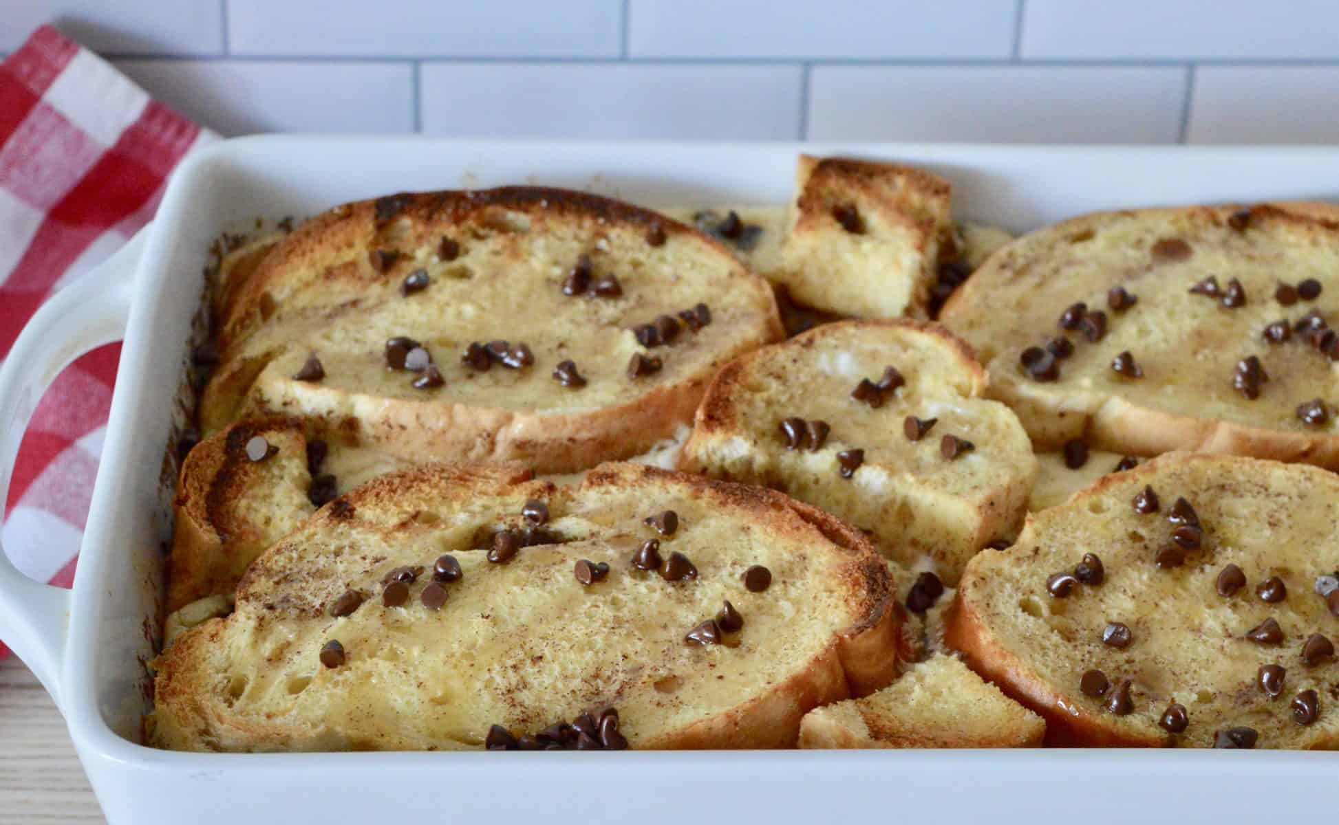 cannoli baked French toast in a white casserole dish. 