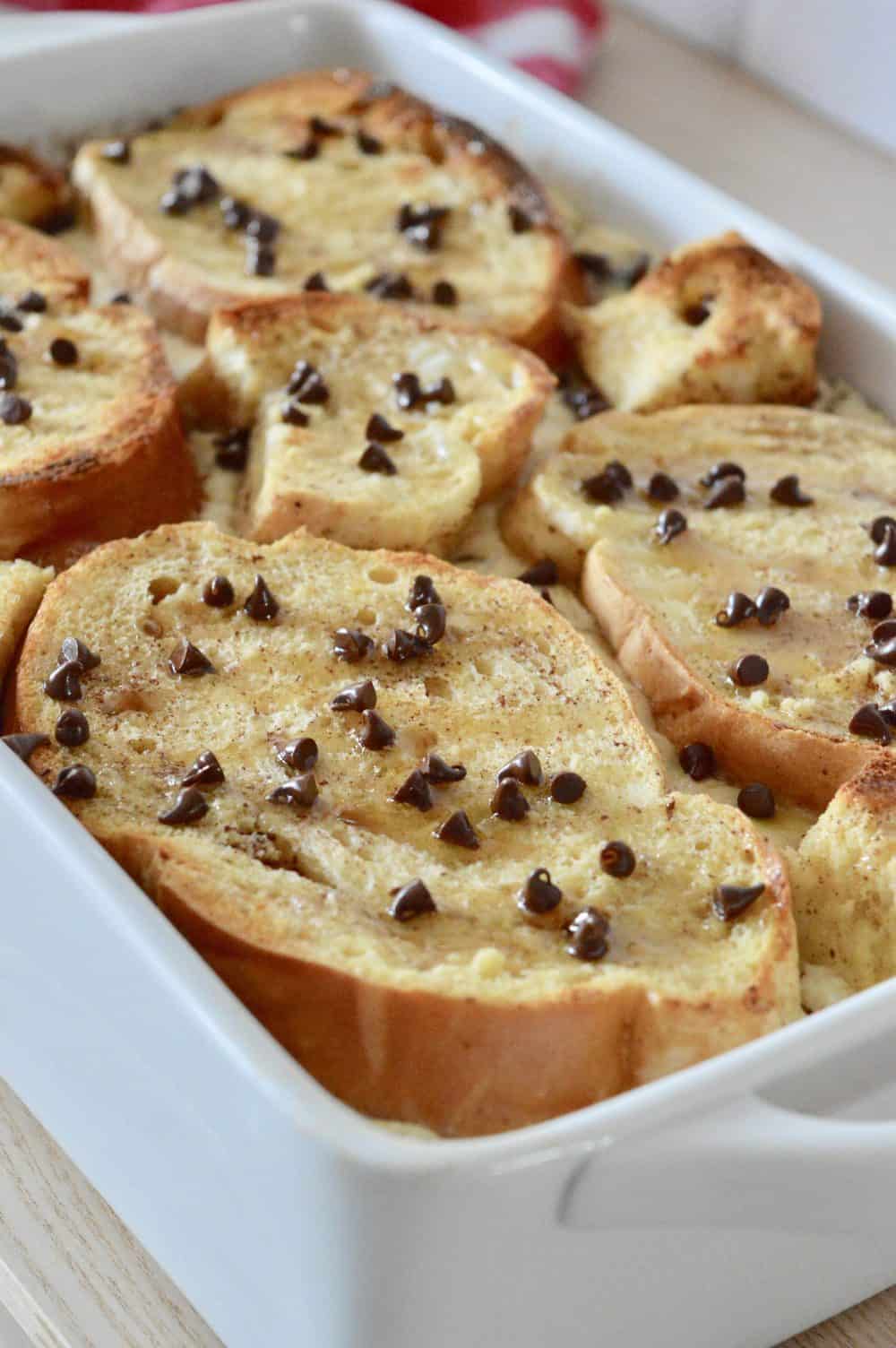 Cannoli Baked French Toast in a white casserole dish. 