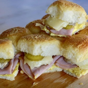 Pull Apart Cuban Sliders on a wood cutting board