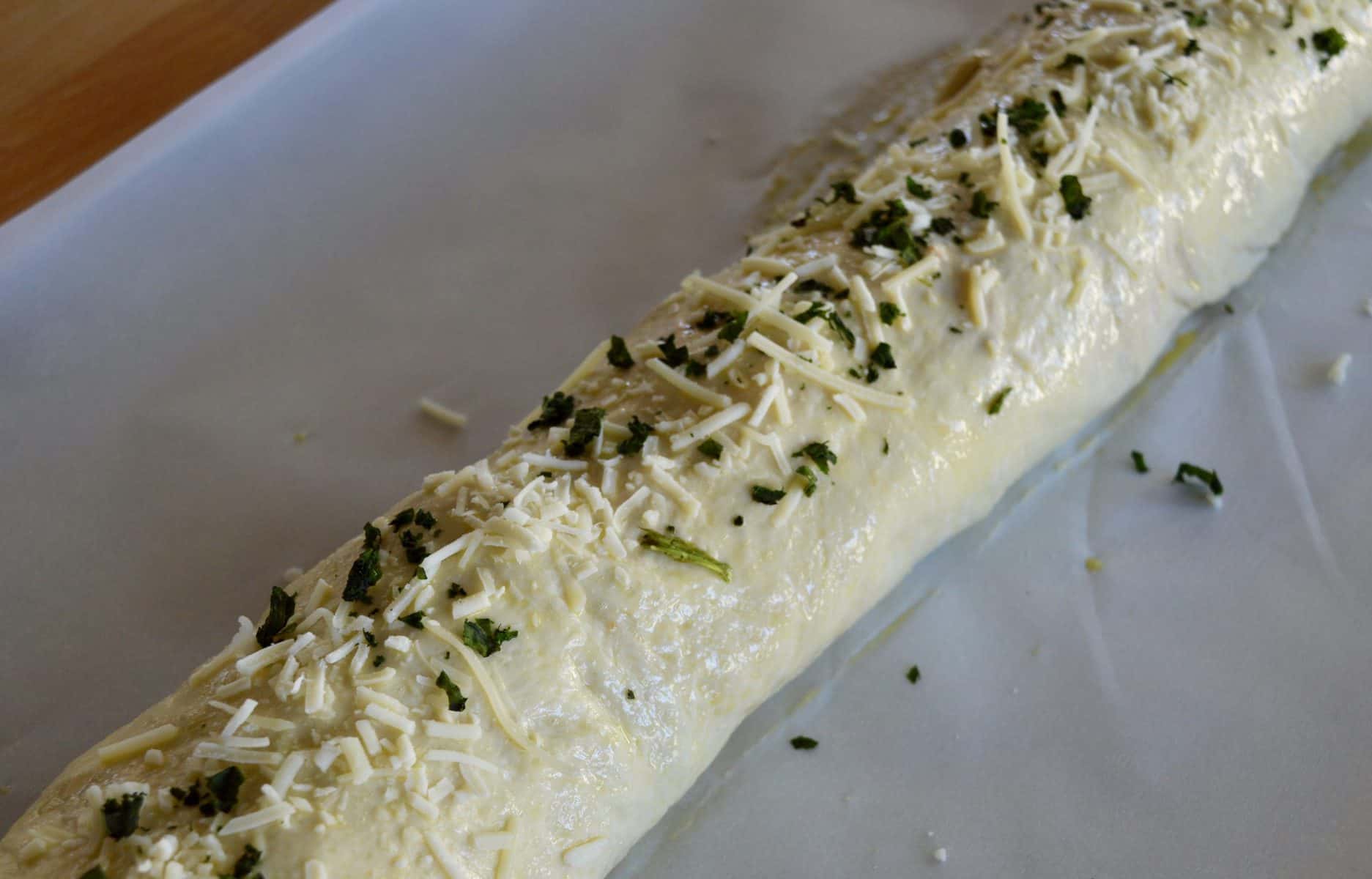 dried basil and parmesan sprinkled over top of Stromboli before baking. 