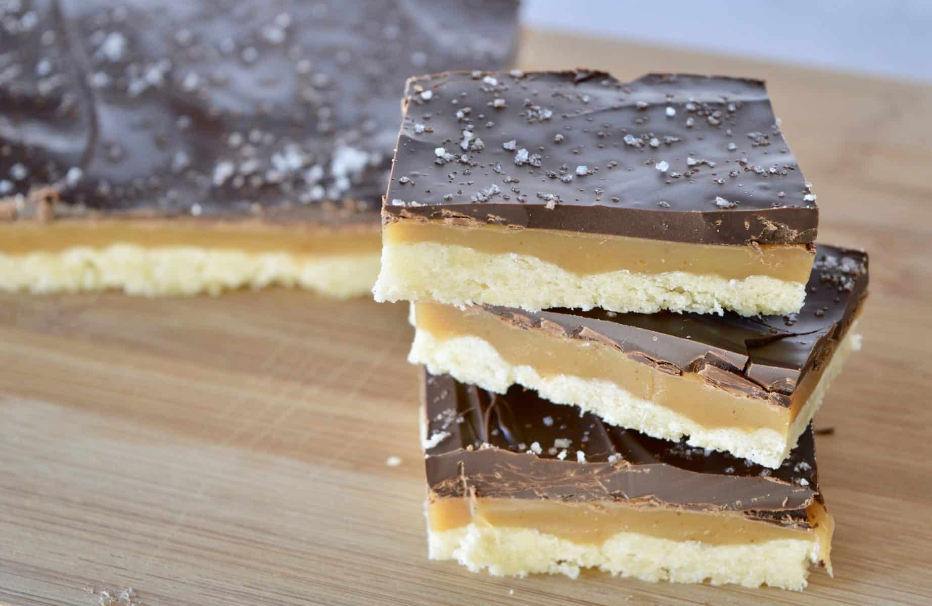 Salted Chocolate Caramel Squares on a cutting board. 