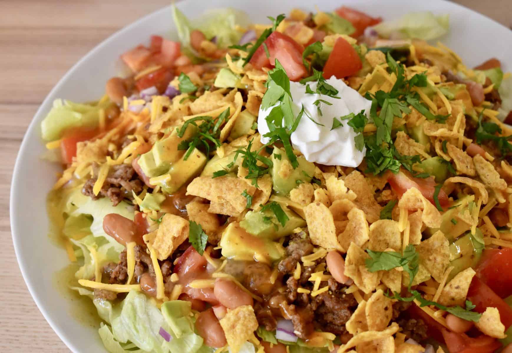 Frito Taco Salad in a white serving bowl. 