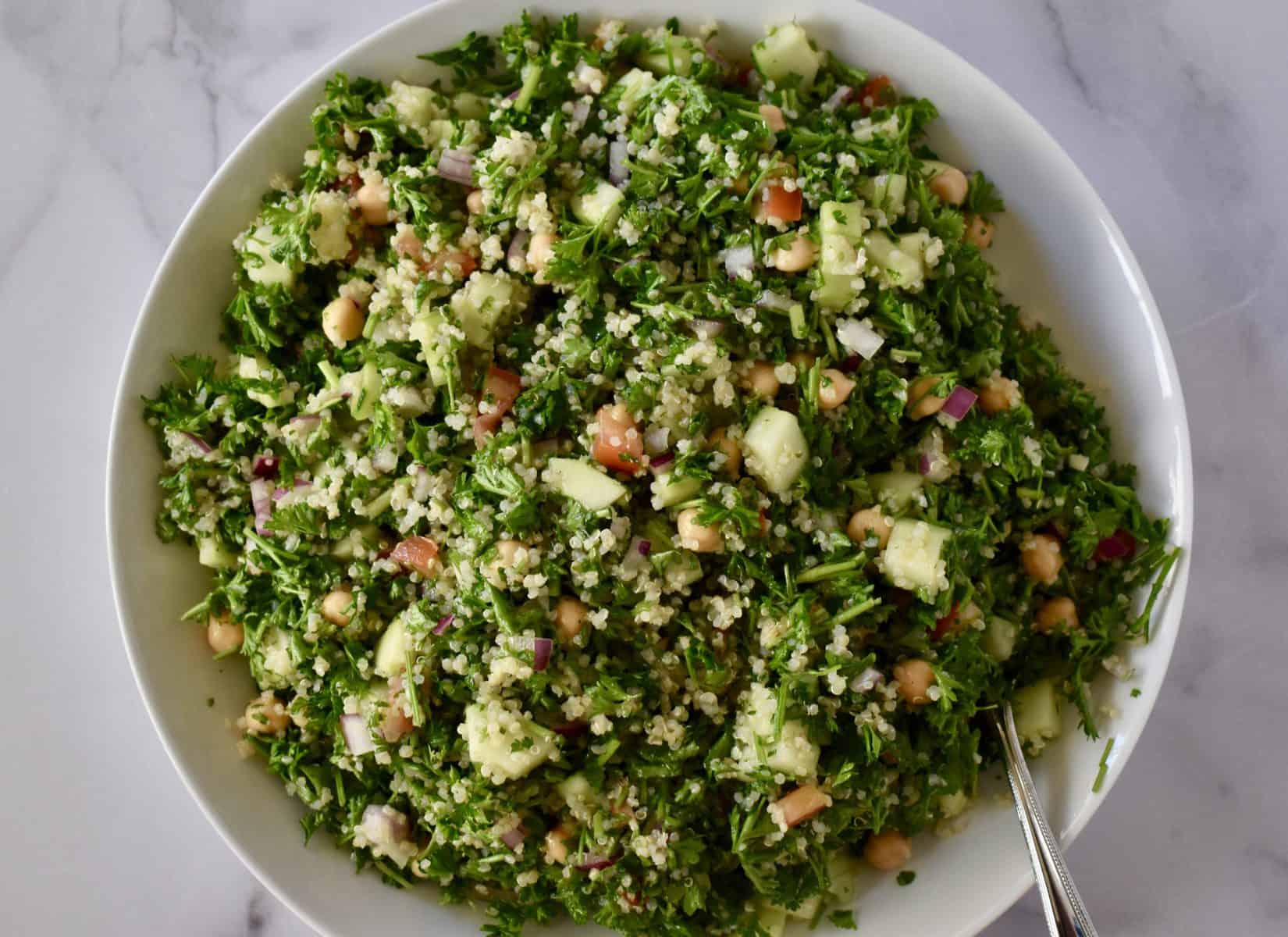 overhead photo of tabbouleh in a white bowl.