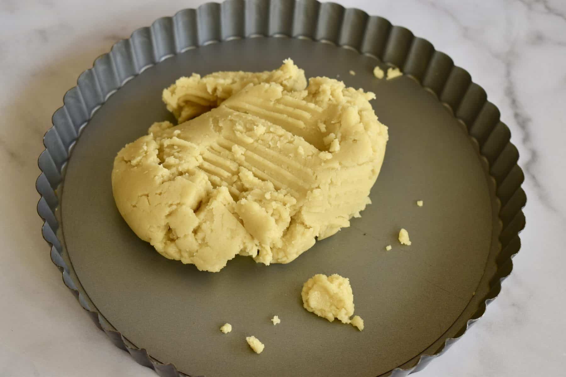 Olive Oil Dough in the bottom of a tin. 
