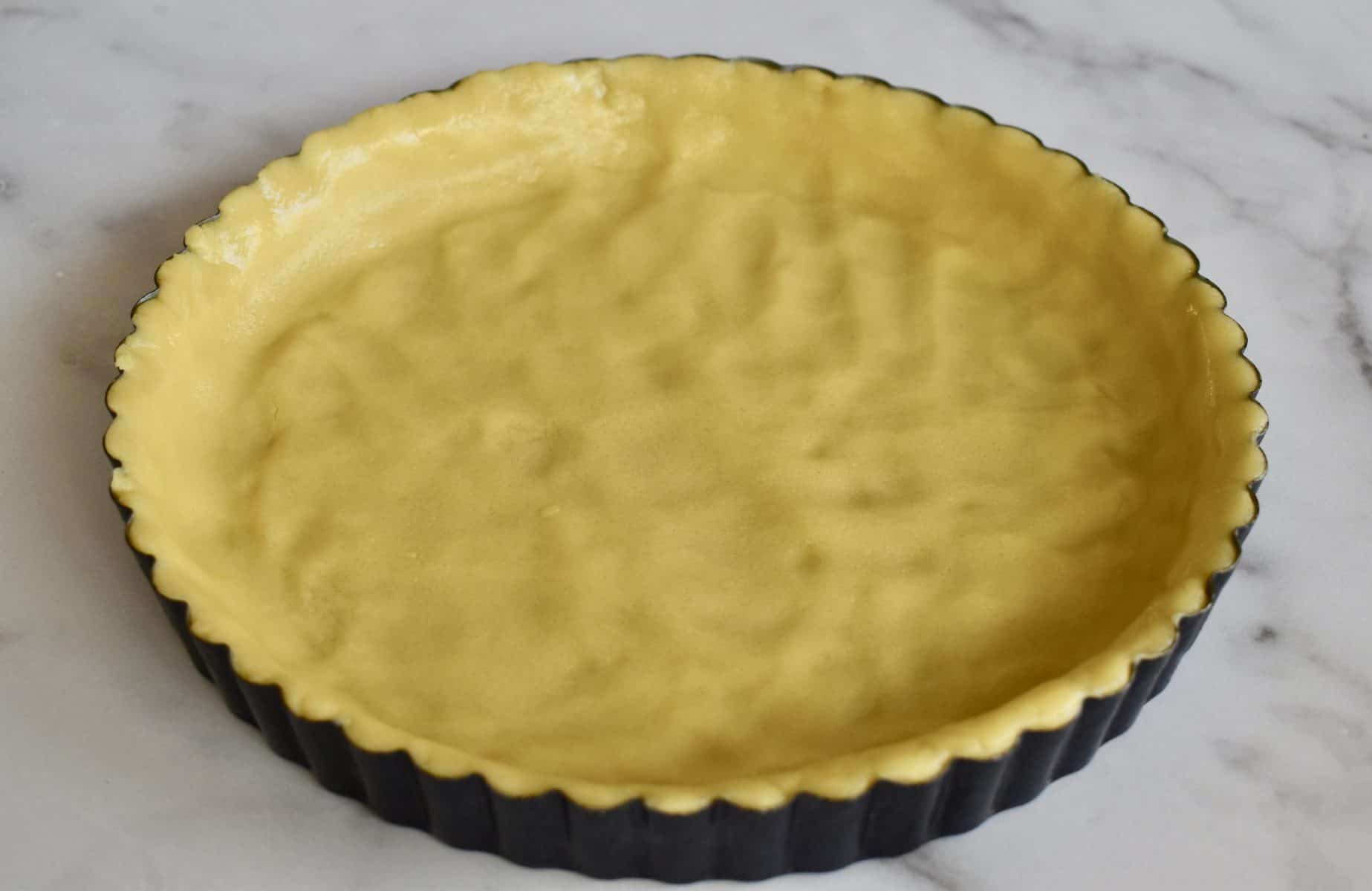 olive oil crust pressed into the bottom and sides of a nonstick tart pan. 