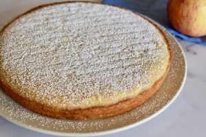Almond Flour apple cake with powdered sugar sprinkled on top.