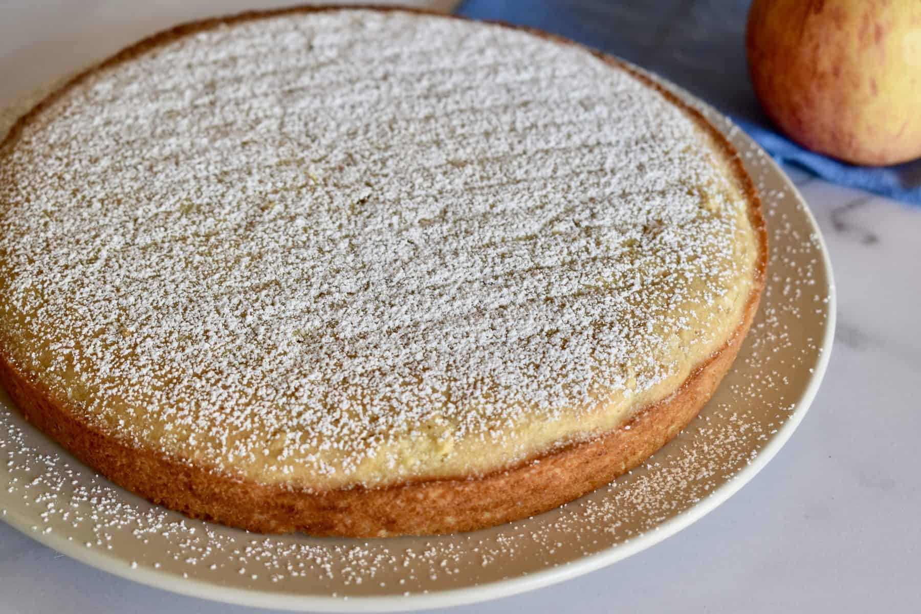 Almond Flour apple cake with powdered sugar sprinkled on top. 