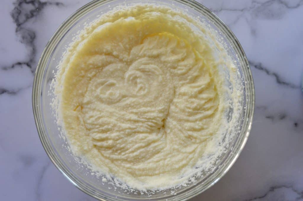 ricotta creamed together with butter and sugar in a mixing bowl. 