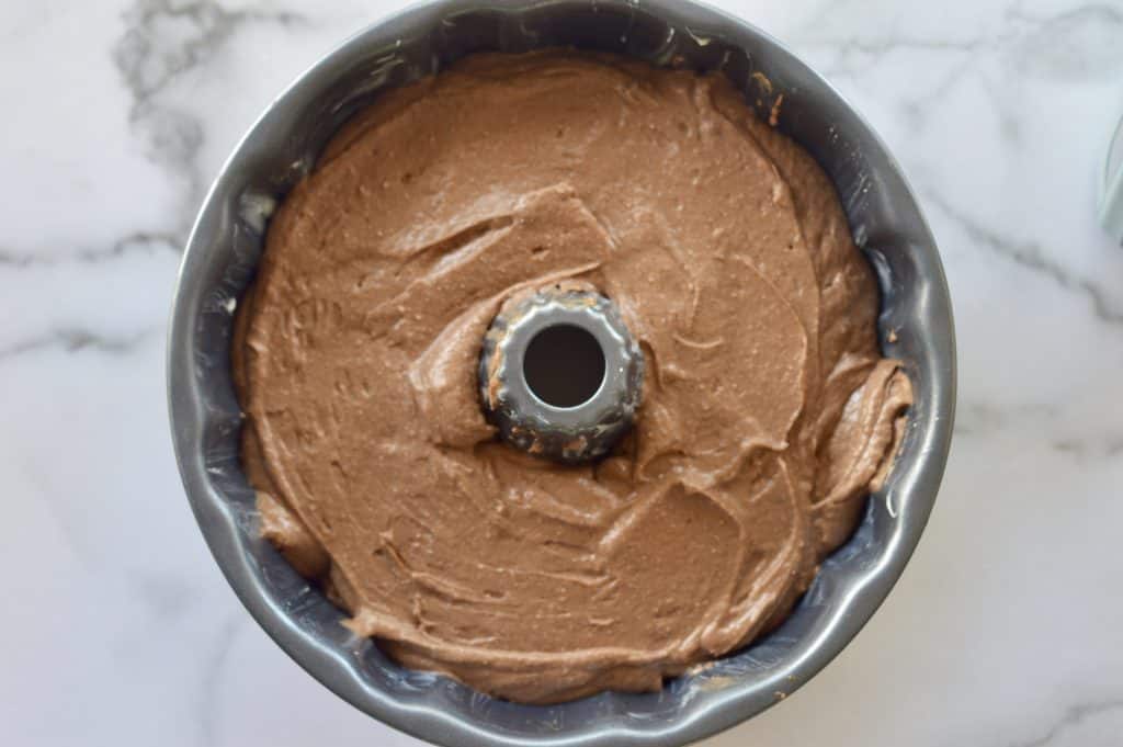 Chocolate ricotta bundt cake batter in the bundt cake pan ready for baking.