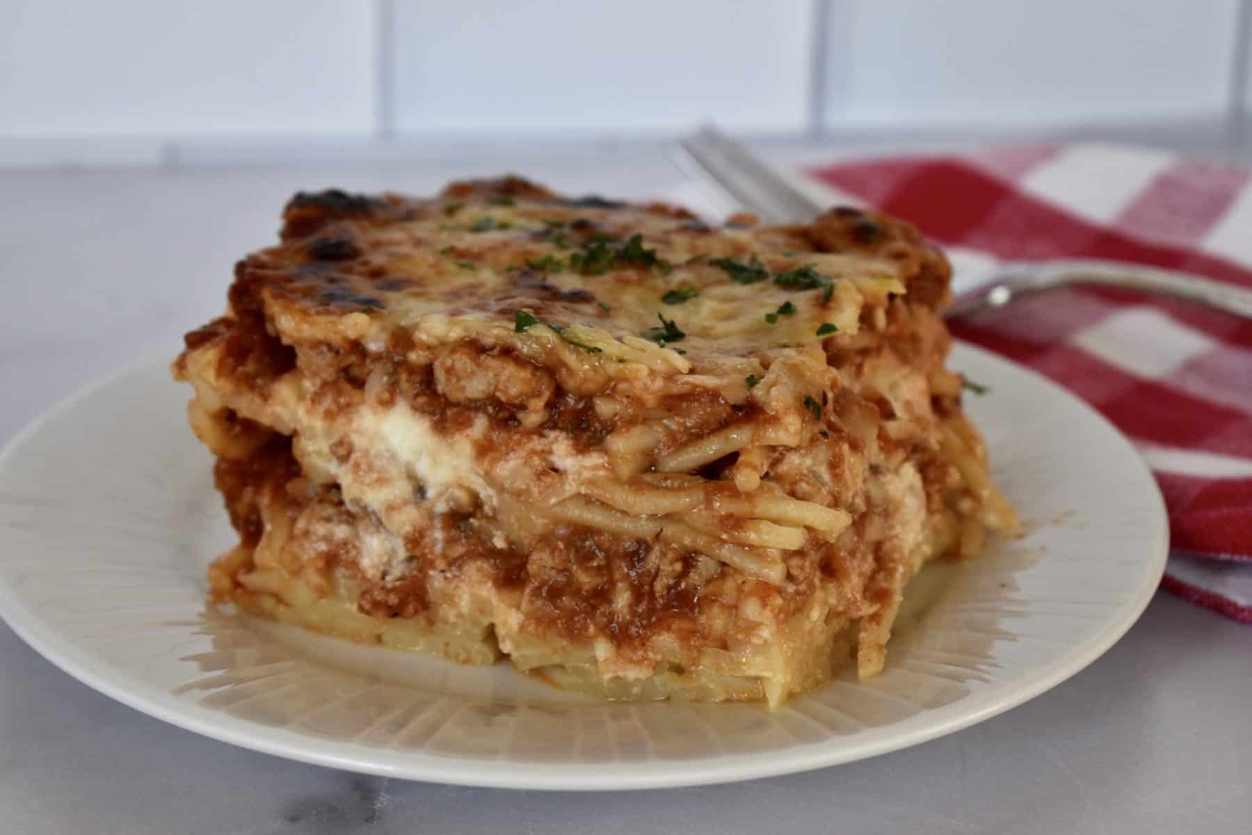 Baked Spaghetti with ground turkey on a plate. 