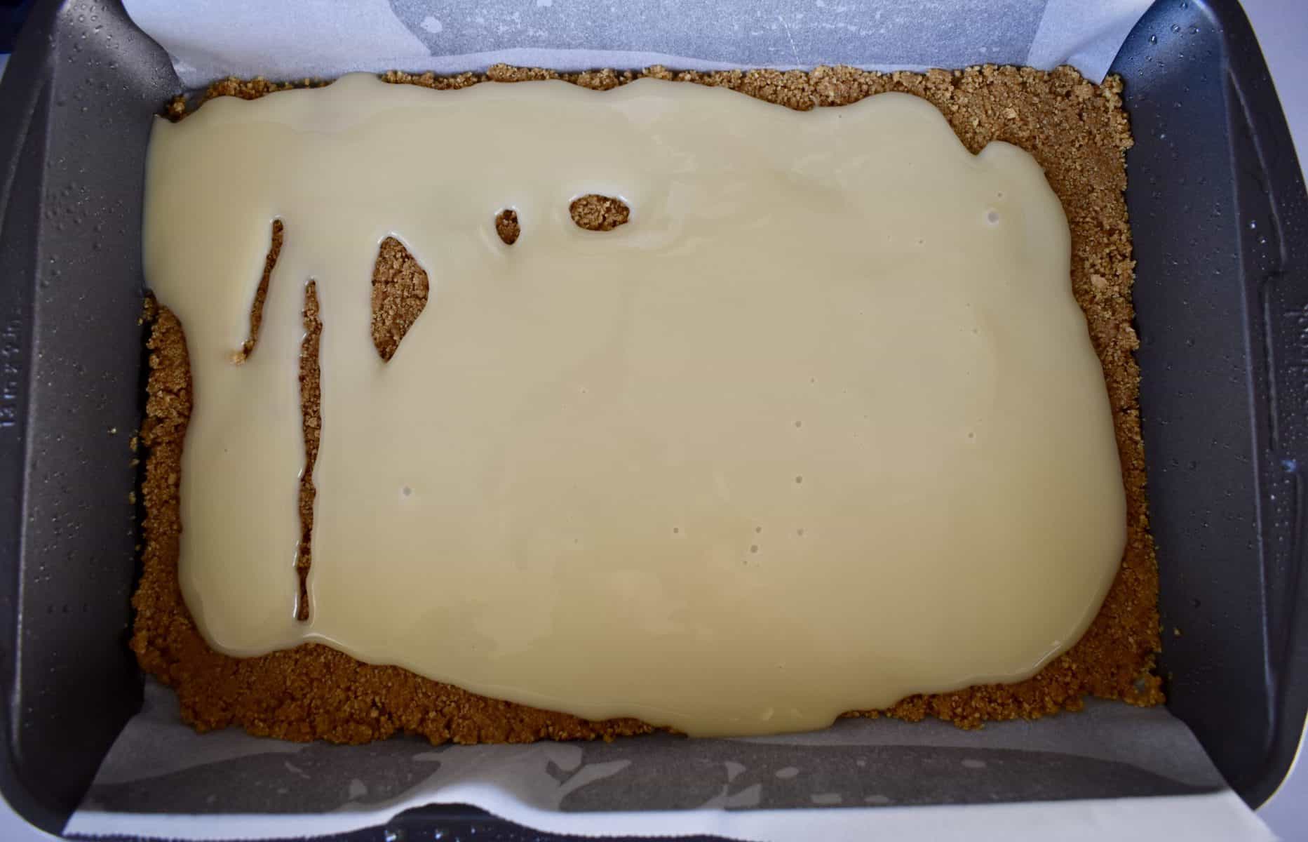 graham cracker crust with sweetened condensed milk poured over top. 