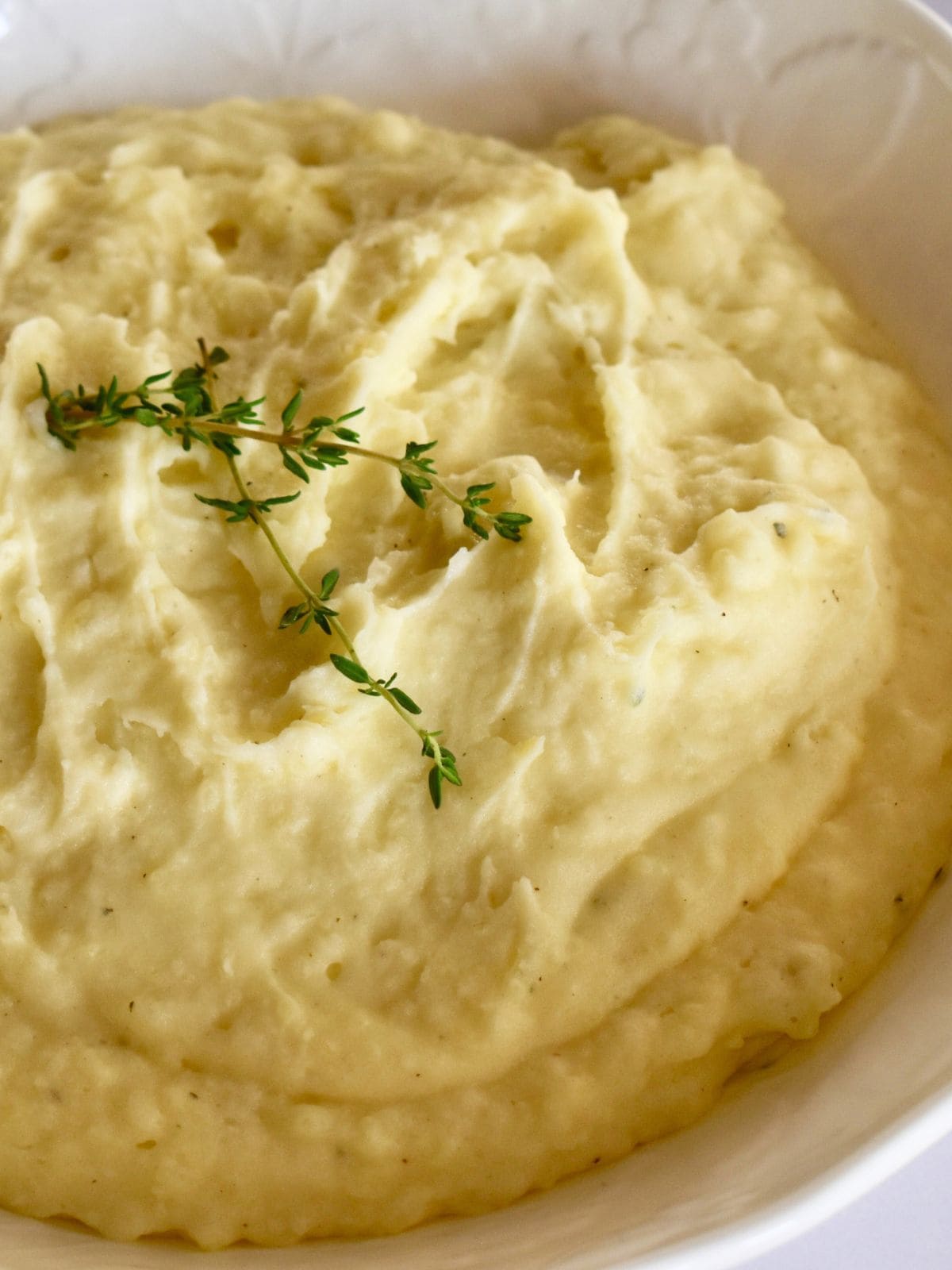 Boursin Mashed Potatoes in a large white serving bowl. 