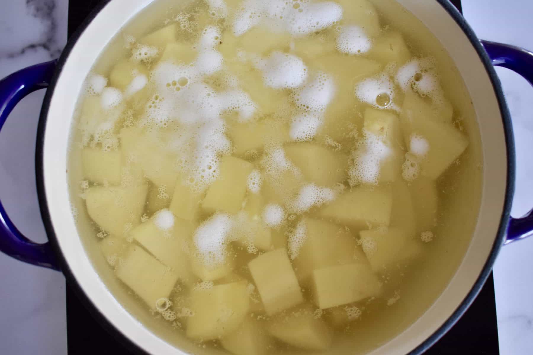 Diced potatoes in a pot of water. 