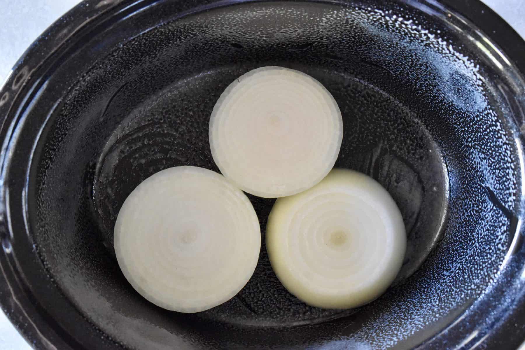 onions on the bottom of the Crock pot 