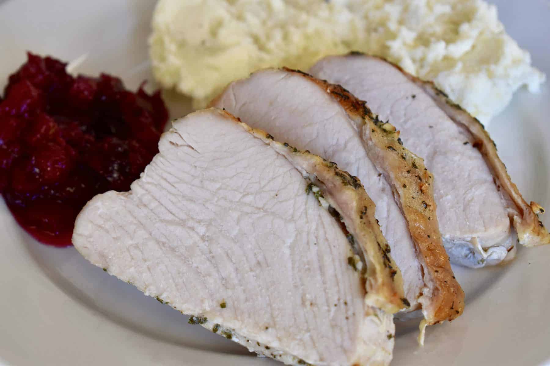 mashed potatoes and cranberries on a plate. 