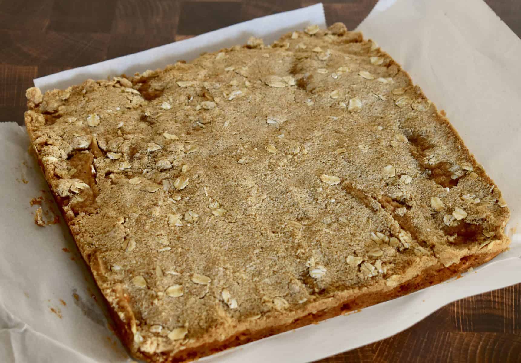 cooled bars removed from the pan and laying on parchment. 