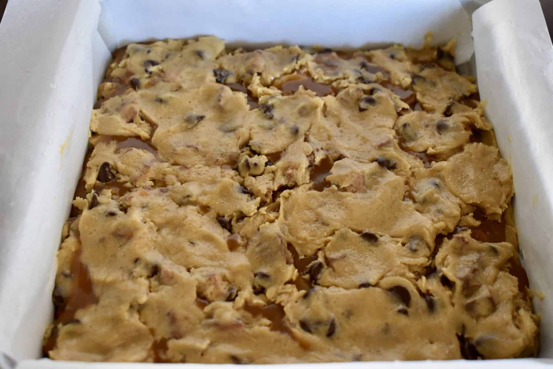 batter pressed over the caramel layer of the bars. 