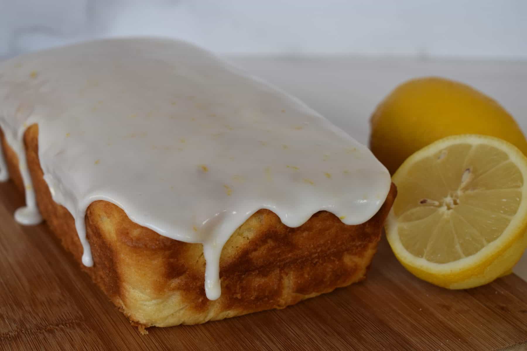 Lemon Ricotta Pound Cake with a lemon glaze dripping down the side. 
