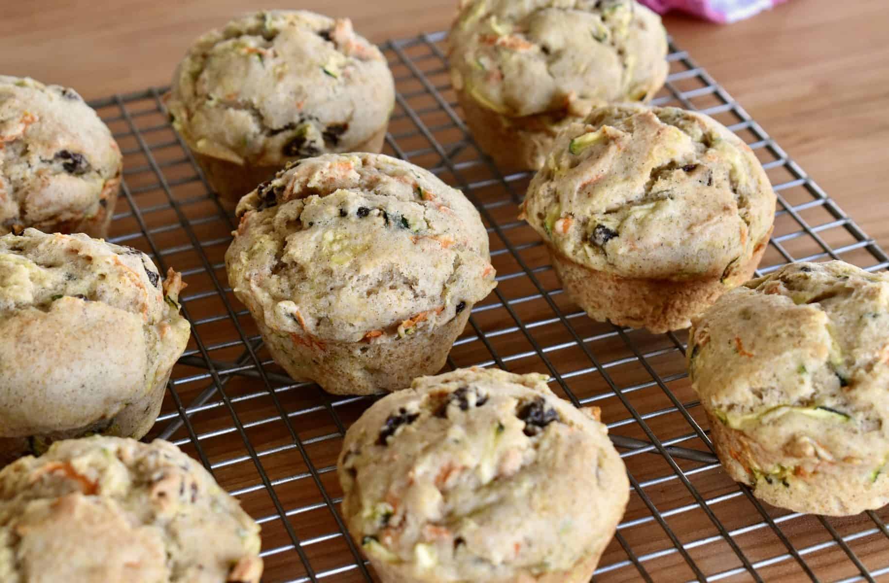 Zucchini Carrot Raisin Muffins on a cooling rack. 