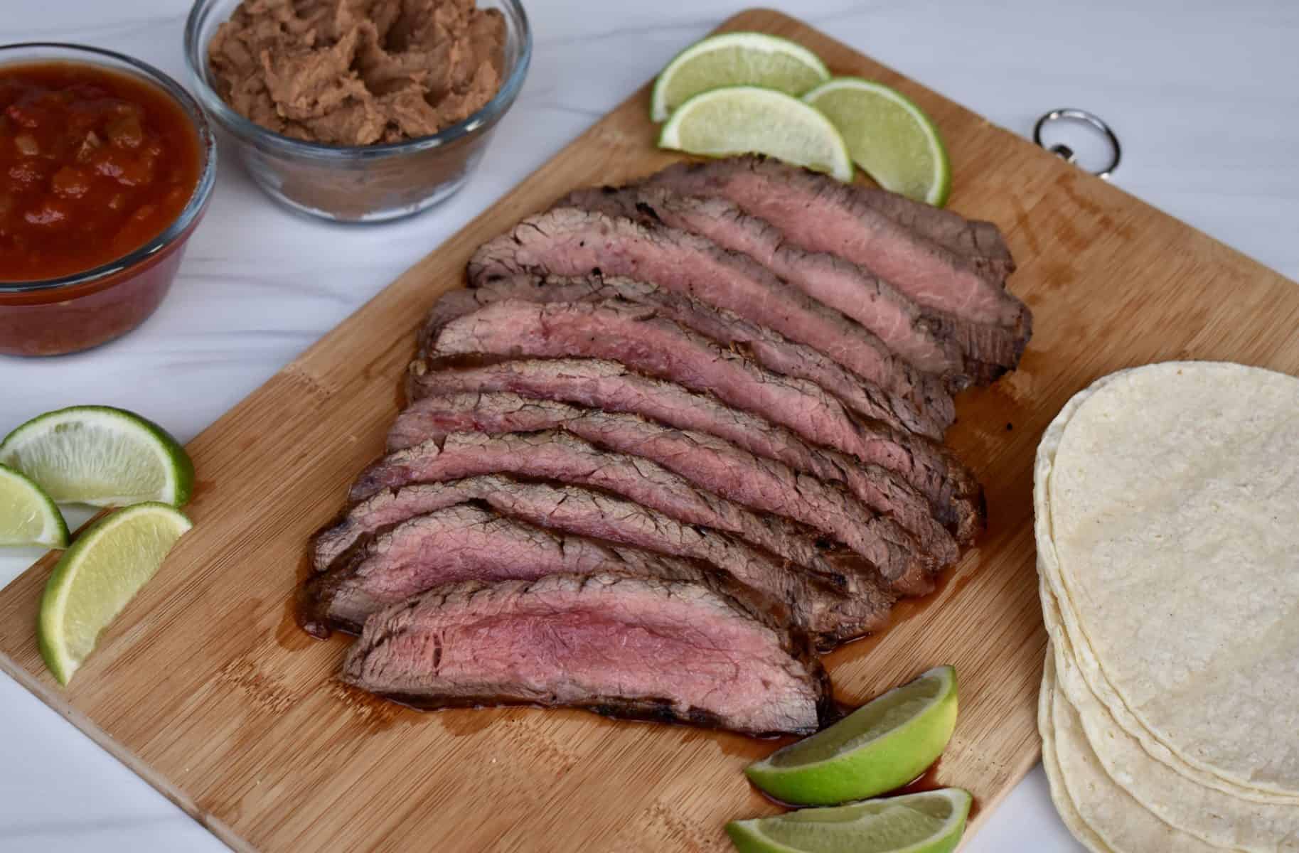 Carne Asada on a wood cutting board. 