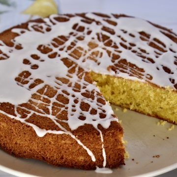 Lemon Polenta Cake on a white plate.