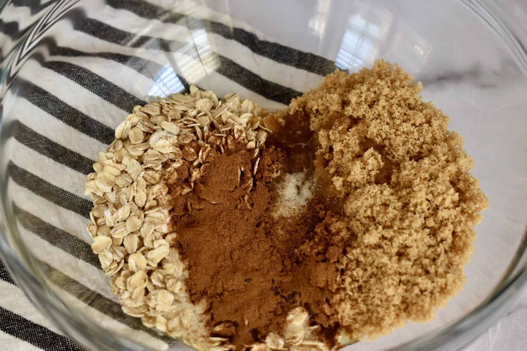 rolled oats, brown sugar, melted butter, and cinnamon in a bowl. 