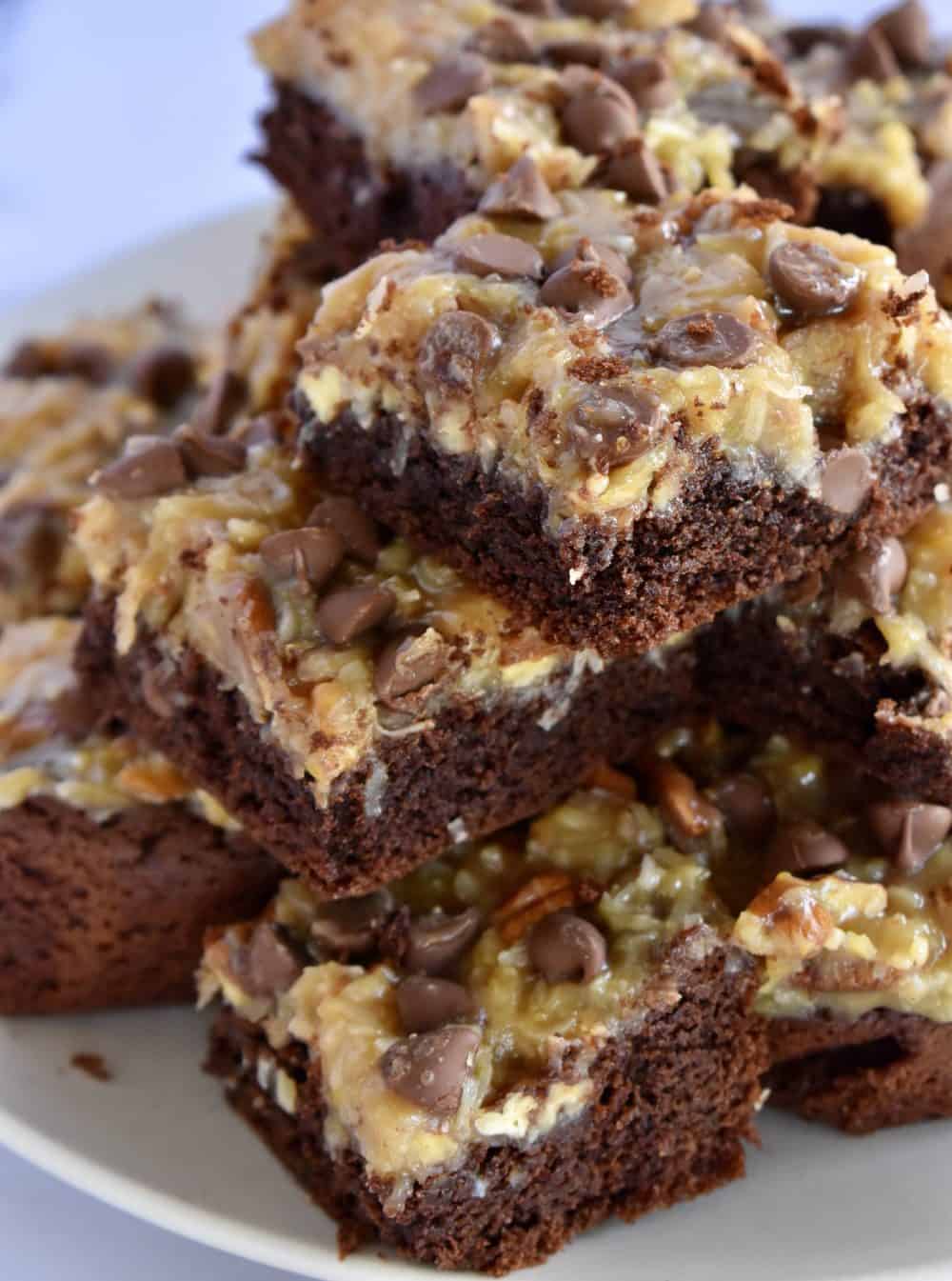 German Chocolate Brownies pilled high on a plate. 