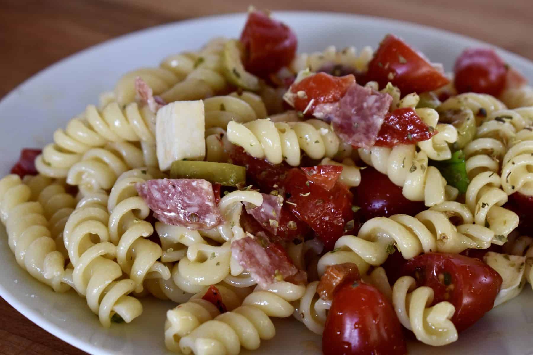 Italian Pasta Salad on a white serving plate. 