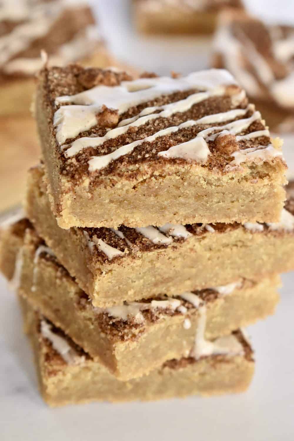 Cinnamon Sugar Blondies stacked high on the counter. 