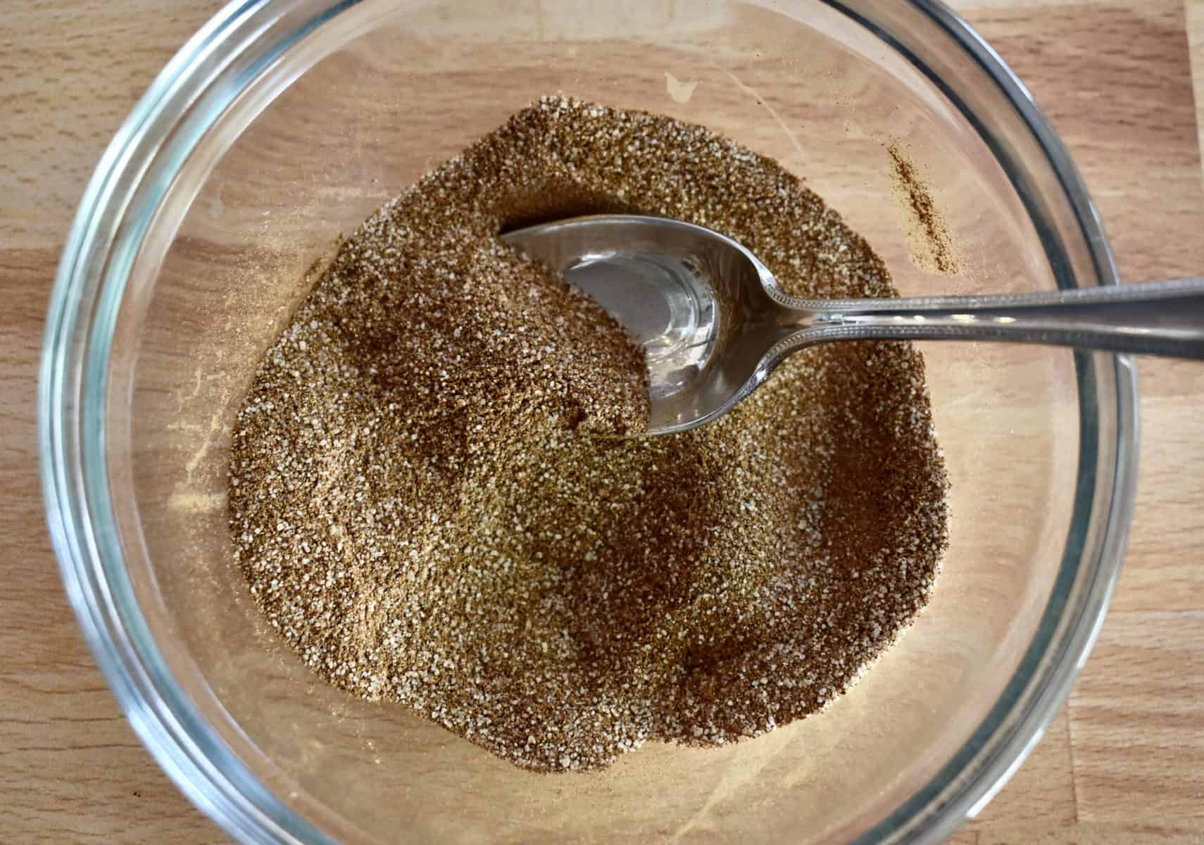 cinnamon and sugar mixed together in a small glass bowl. 