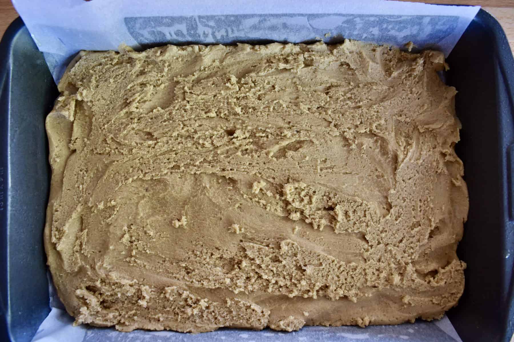 batter spread into the bottom of prepared baking pan. 