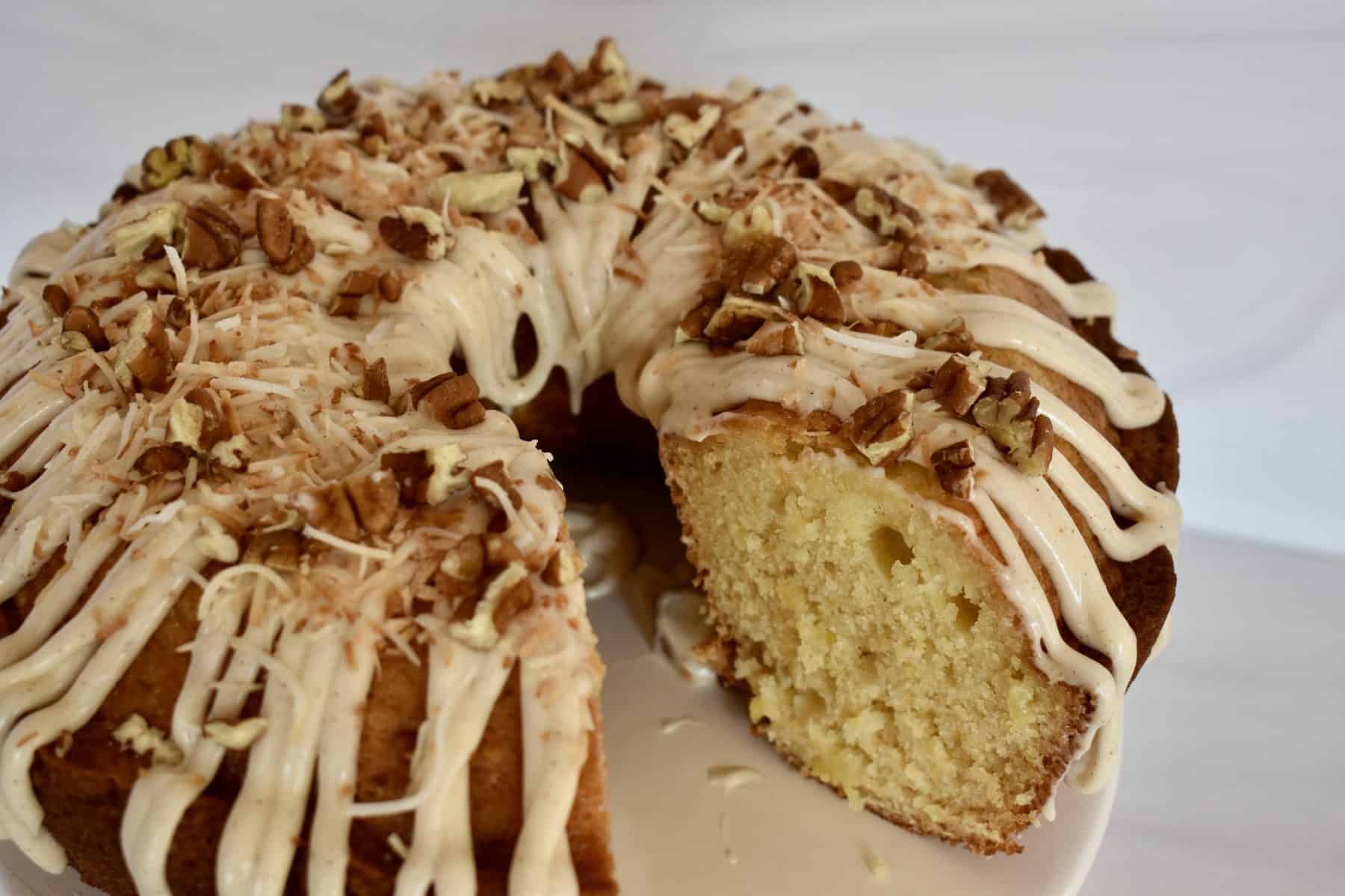 Pineapple Bundt Cake on a white pedestal. 