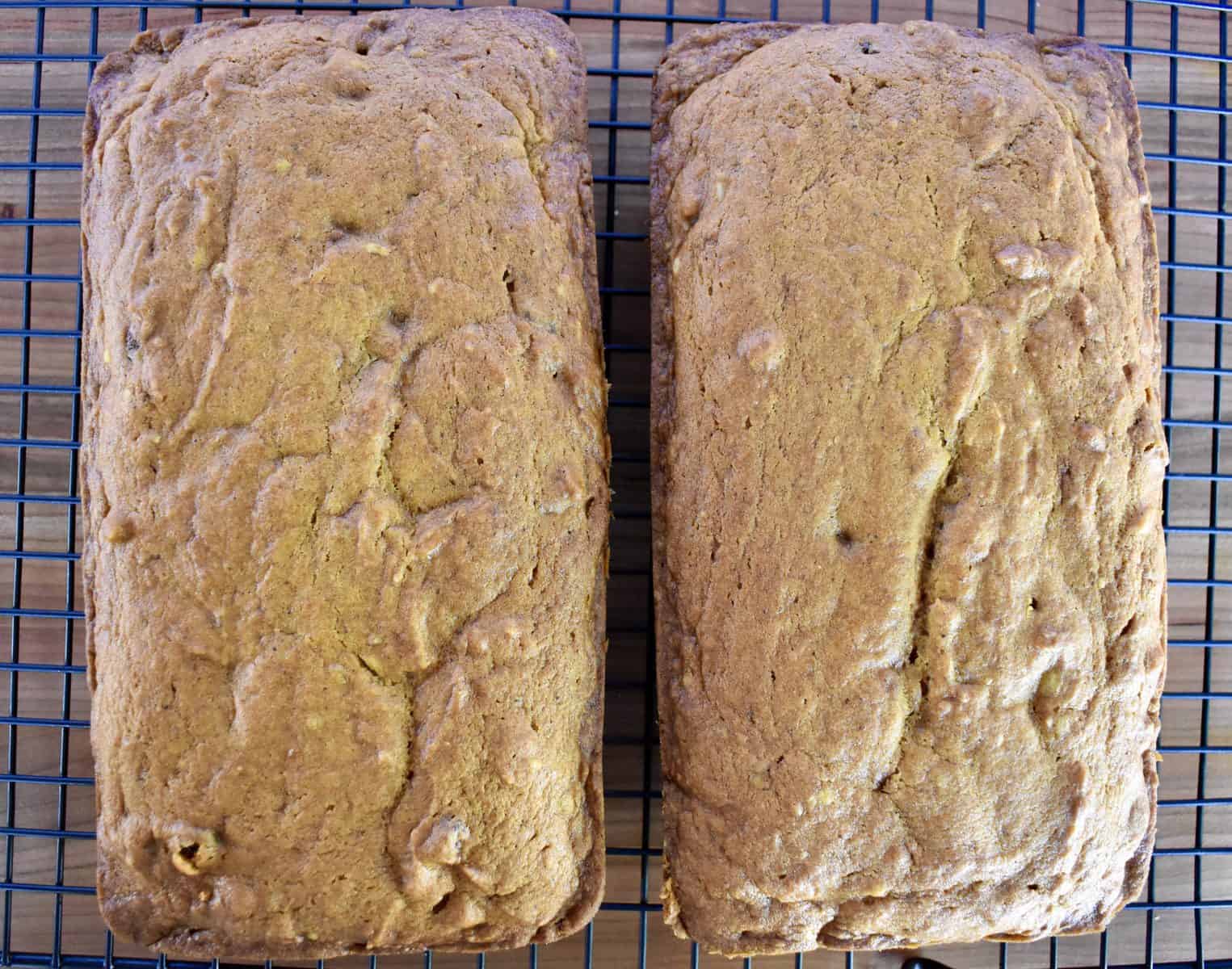 overhead photo of two loaves of bread cooling on a cooling rack. 