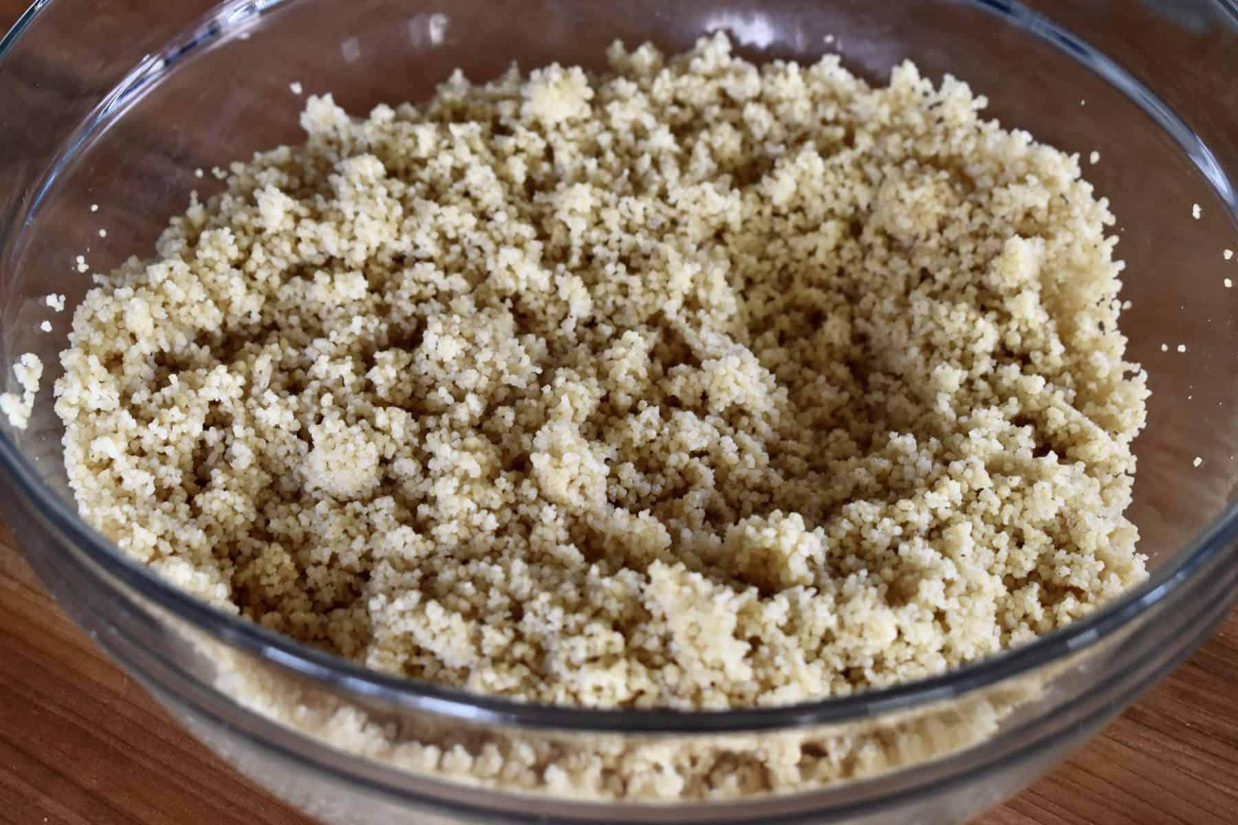cooked couscous in a glass bowl. 