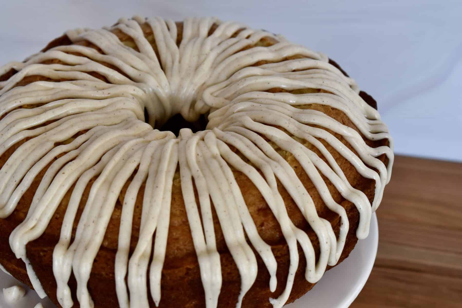 Cream cheese frosting drizzled over the top of the pineapple Bundt Cake. 