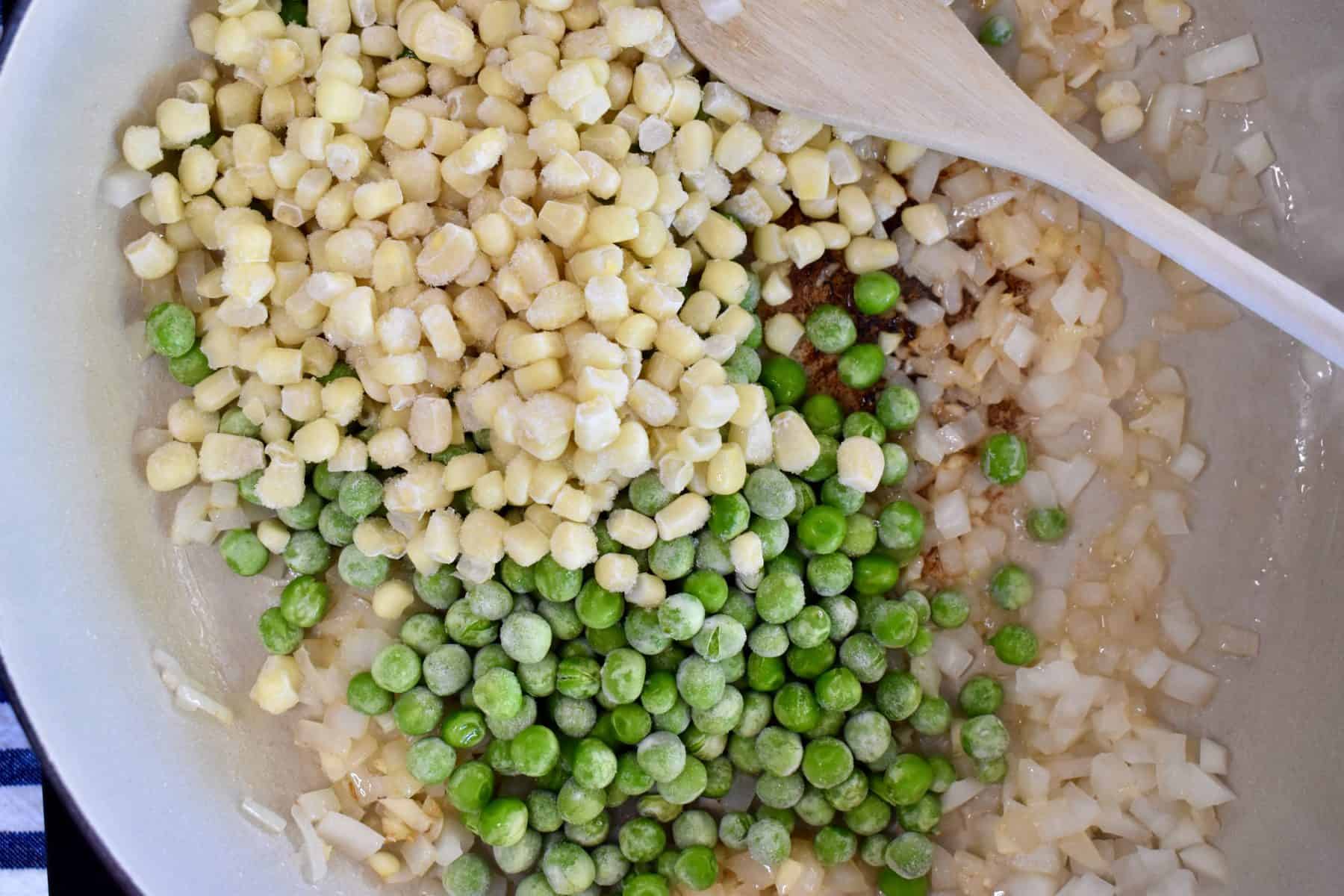 frozen peas and corn added the skillet. 