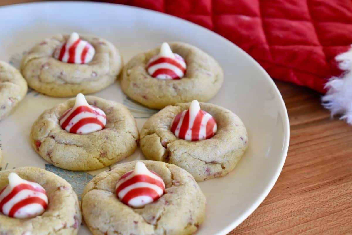 Candy Cane Kiss cookies on a white plate. 